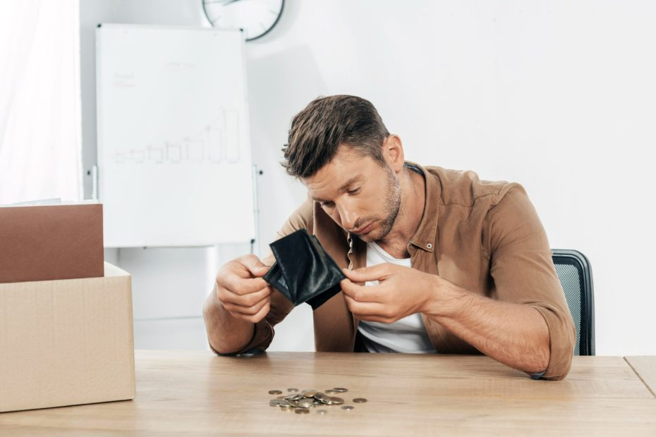 Man emptying change from wallet