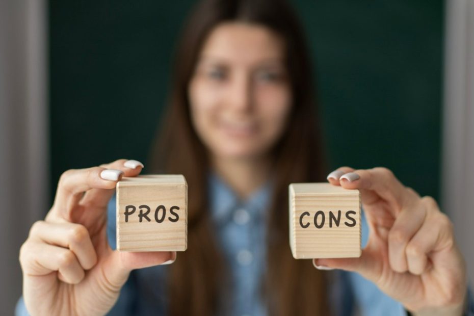 Woman holding Pros and Cons blocks